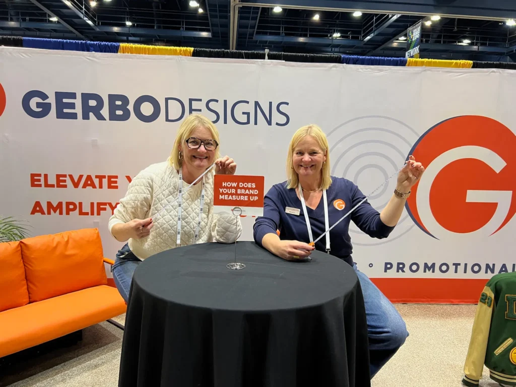 Sally and Shelly at the Central Valley Expo in front of the Gerbo Designs booth.